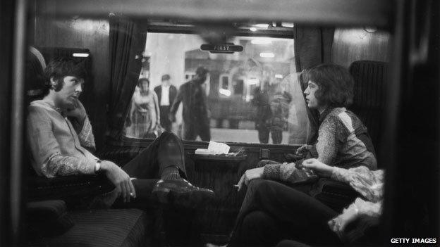 Paul McCartney and Mick Jagger in a first-class carriage 1967
