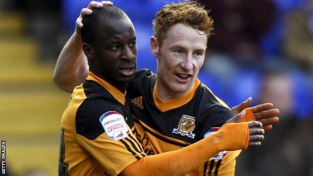 Hull's Sone Aluko celebrates his second goal with Stephen Quinn