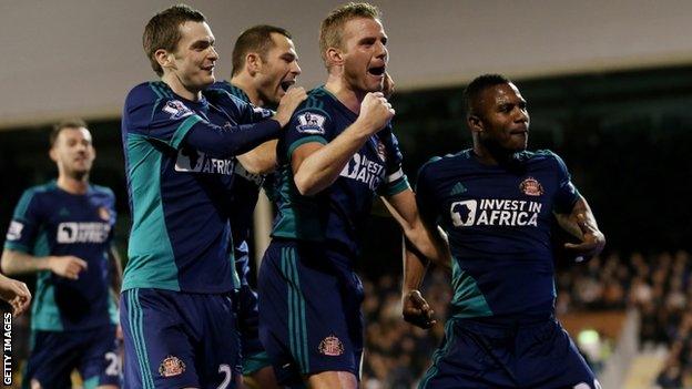 Sunderland players celebrate their third goal