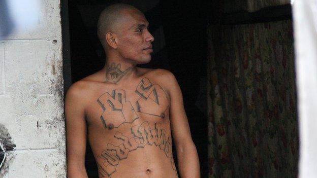 A Mara Salvatrucha gang member with chest tattoos