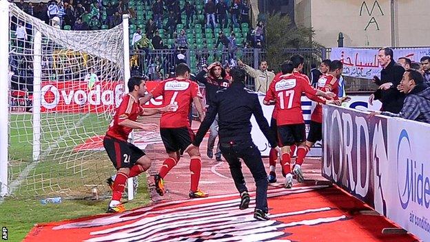 Ahly players flee during Port Said riot