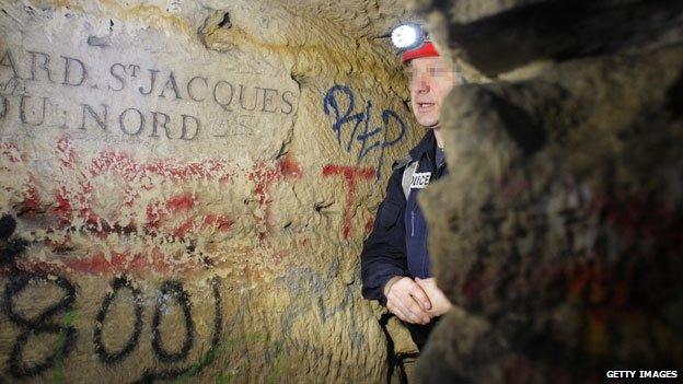 French special police squad 'Brigade d'intervention de la compagnie sportive' looks at a painted wall in the room called 'Galerie des promos'