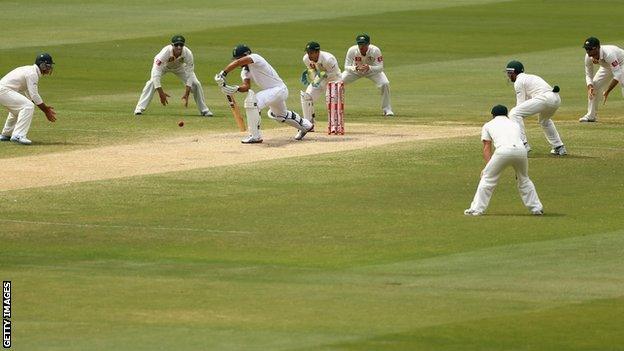 Faf du Plessis is surrounded by fielders