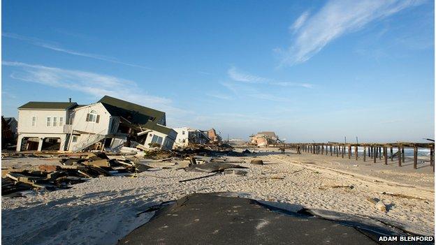 Ruined homes and the Surf Club in the distance on Ocean Avenue