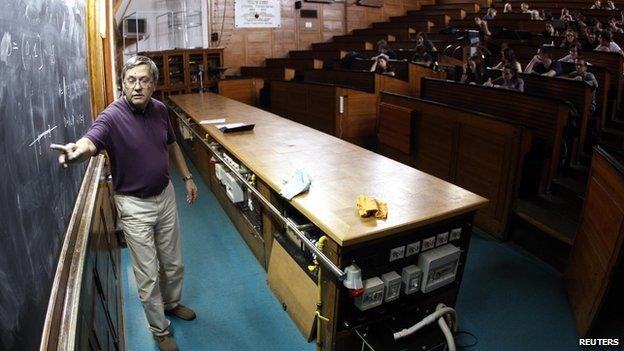 A lecturer talks to his students