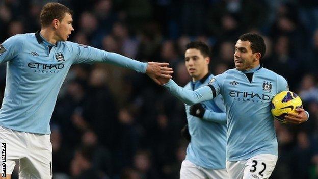 Manchester City celebrate Carlos Tevez's equaliser