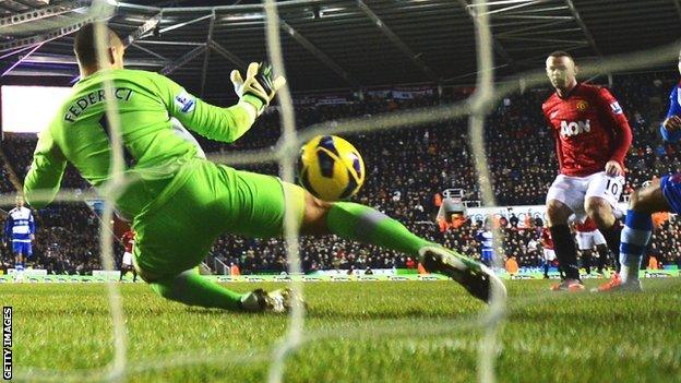 Wayne Rooney (right) scores past Adam Federici