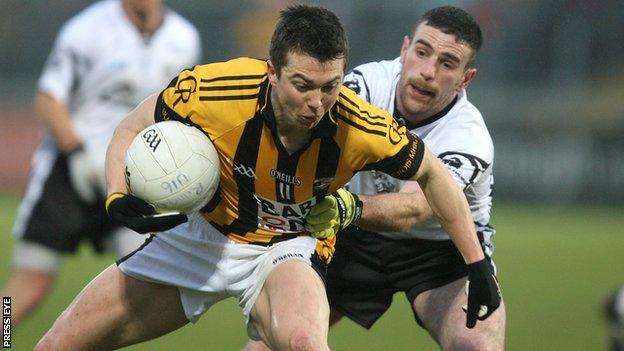 Crossmaglen's Stephen Kernan is challenged by Donal Kane