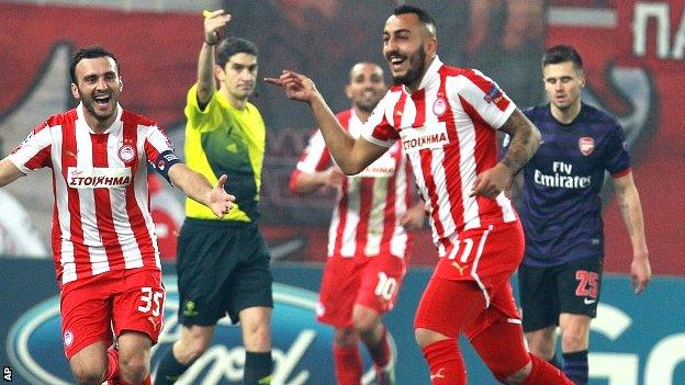 Kostas Mitroglou celebrates scoring the winner for Olympiakos against Arsenal