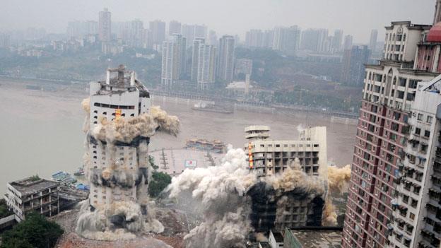 The Three Gorges Hotel and a passenger terminal are imploded in Chongqing, China