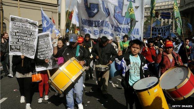 Activists play drums during an anti-government demonstration called by the Argentine Workers Confederation