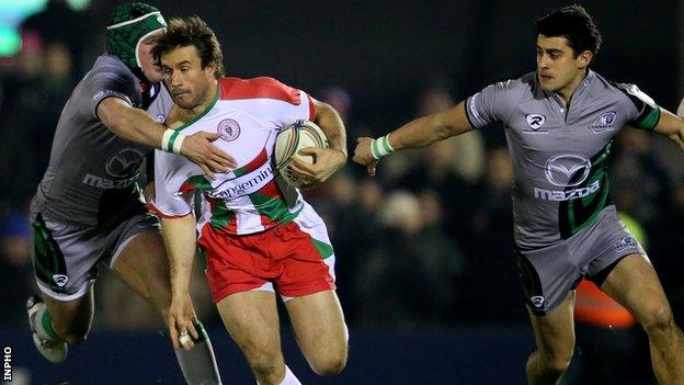 Connacht's Dave McSharry and Tiernan O'Halloran tackle Marcelo Bosch of Biarritz