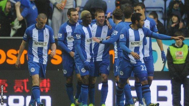 Wigan celebrate James McCarthy's goal against QPR