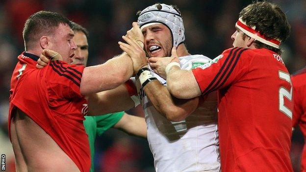 Munster forwards Mike Sherry and David Kilcoyne clash with Will Fraser at Thomond Park