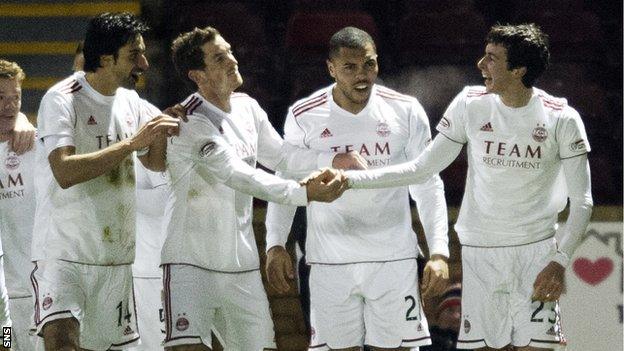 The Aberdeen players celebrate Joe Shaughnessy's (right) goal