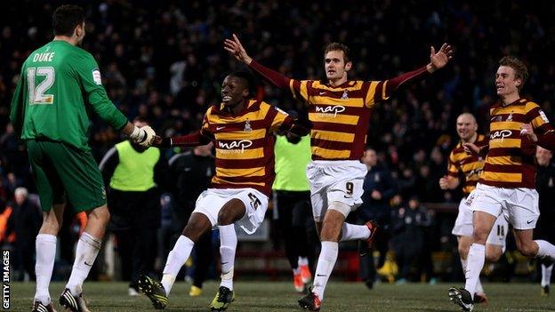 Bradford City players celebrate victory over Arsenal