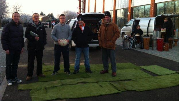 Parts of the old Luton Town artificial surface are put together