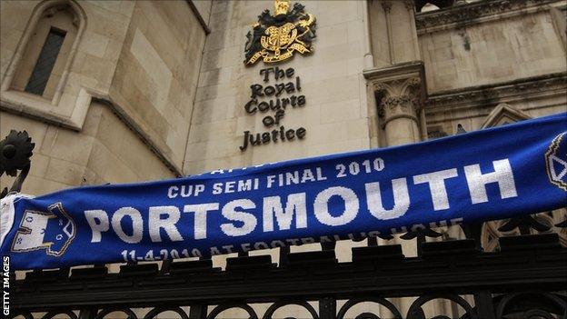 A Portsmouth scarf on the railings outside the Royal Courts of Justice