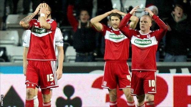 Middlesbrough players dejected after Swansea score