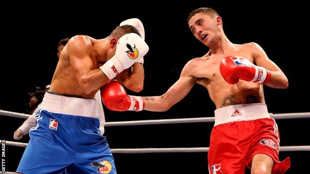 The British Lionhearts's Andrew Selby (right) in control against the German Eagles's Redouane Asloum.