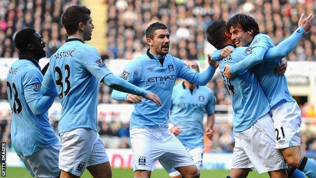 Manchester City players celebrate Javi Garcia's goal at Newcastle