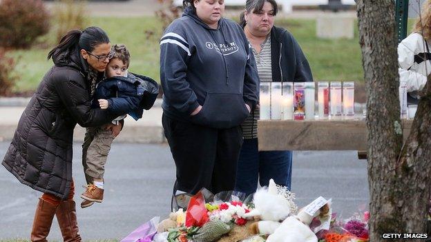 Mourners at a makeshift vigil in Newtown