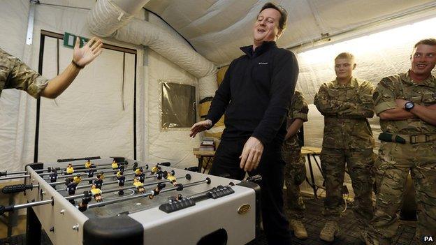 David Cameron plays table football