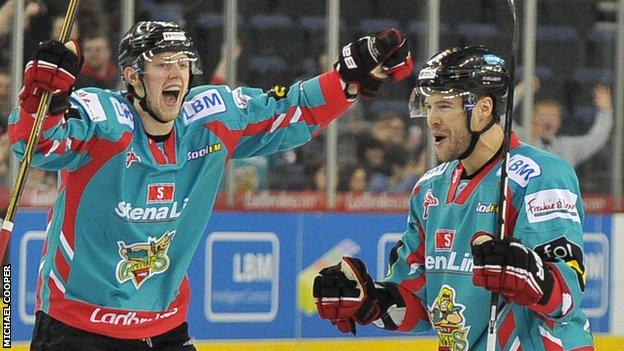 Sam Roberts (right) of the Belfast Giants celebrates with Davy Phillips after scoring the first goal against the Coventry Blaze