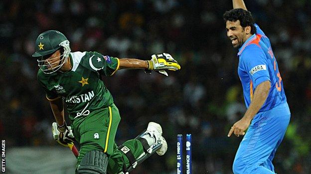 India's Zaheer Khan (right) with Pakistan's Yasir Arafat