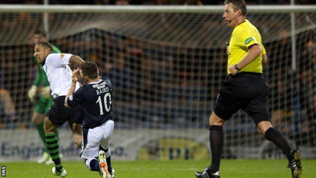 Kelvin Wilson catches John Baird with an elbow during Celtic's win over Dundee