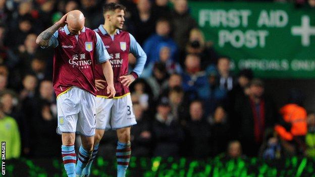 Dejected Aston Villa players Stephen Ireland and Chris Herd