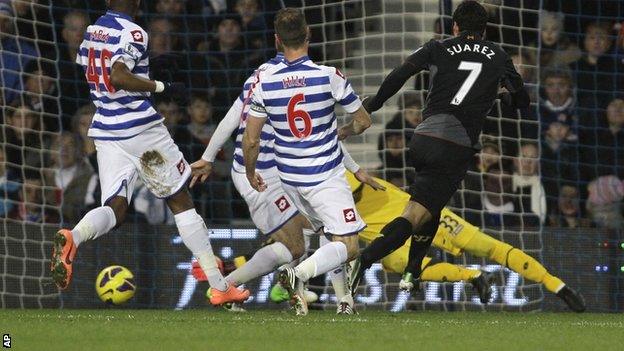 Liverpool striker Luis Suarez (right) scores against QPR