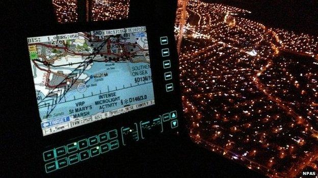 Night time view over Canvey Island from inside the Essex-based police helicopter