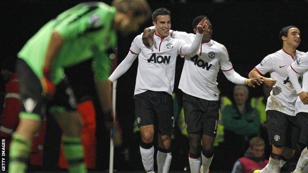 Robin van Persie (centre) celebrates