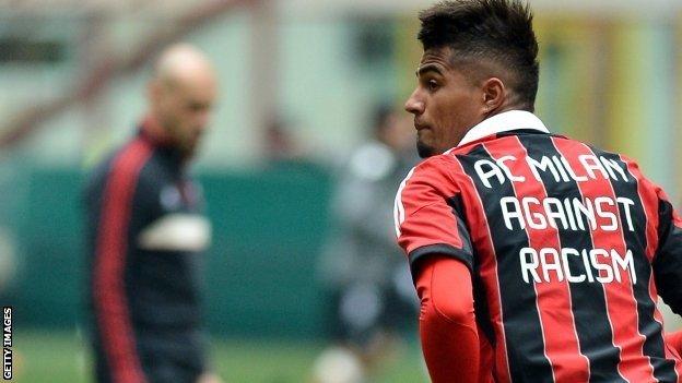 AC Milan's Ghana defender Kevin-Prince Boateng warms up, wearing a jersey against the racism