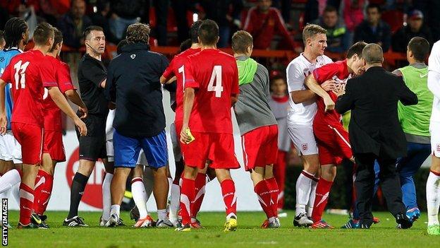 England U21 and Serbia U21 players clash