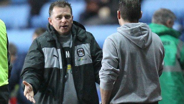 Sky Blues boss Mark Robins discusses tactics with Preston counterpart Graham Westley