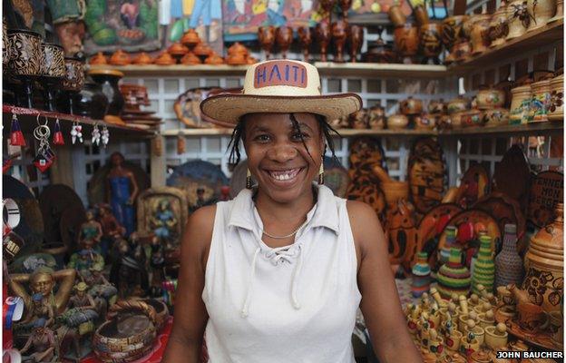 Woman wearing Haiti hat