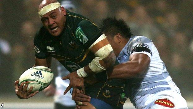 Northampton prop Soane Tongauiha is tackled by Castres Joe Tekori