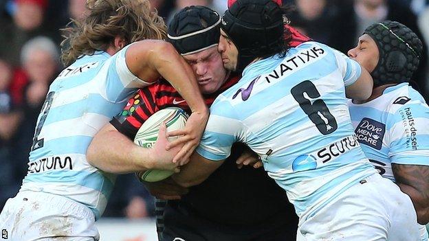 Saracens' former England prop Matt Stevens takes a double tackle from the Racing pack