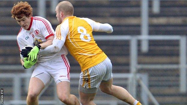 Tyrone's Peter McCann in action against Sean McVeigh of Antrim