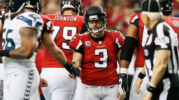 Matt Bryant (centre) is congratulated for kicking the winning field goal for the Atlanta Falcons