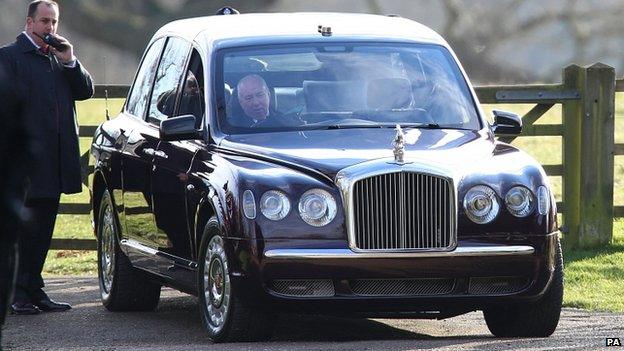 The Queen's driver tries to start her Bentley after it failed to start first time at Mary Magdalene Church