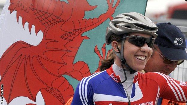 Nicole Cooke with a Welsh flag