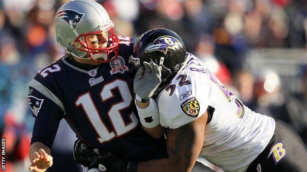 Ray Lewis (right) tackles Tom Brady during a 2010 clash between the Baltimore Ravens and the New England Patriots