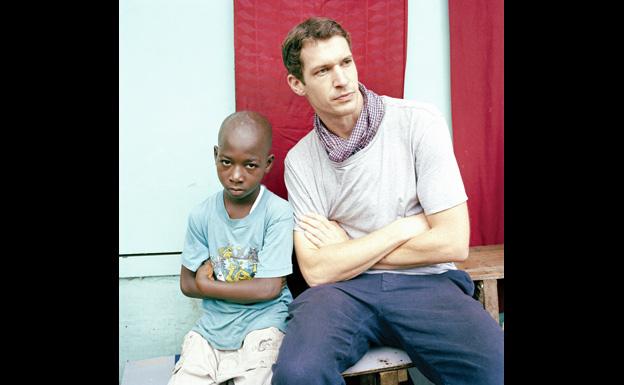 With a young boy in west Africa - Tim Hetherington/Magnum