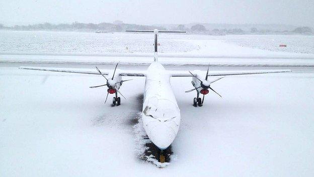 A grounded plane at the snow-strewn Southampton Airport on Friday morning