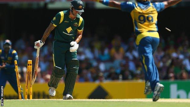 Mitchell Johnson is bowled by Lasith Malinga