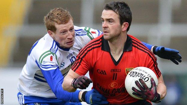 Monaghan's Kieran Hughes battles with Down's Mark Poland