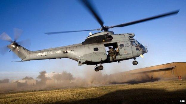 A helicopter carrying French soldiers takes off for an operation in northern Mali